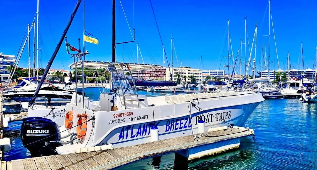 Atlantic Breeze — our tour boat at Marina de Lagos, Lugar 31 Atlantic Breeze tour boat with ATLANTIC BREEZE BOAT TRIPS branding moored at Marina de Lagos